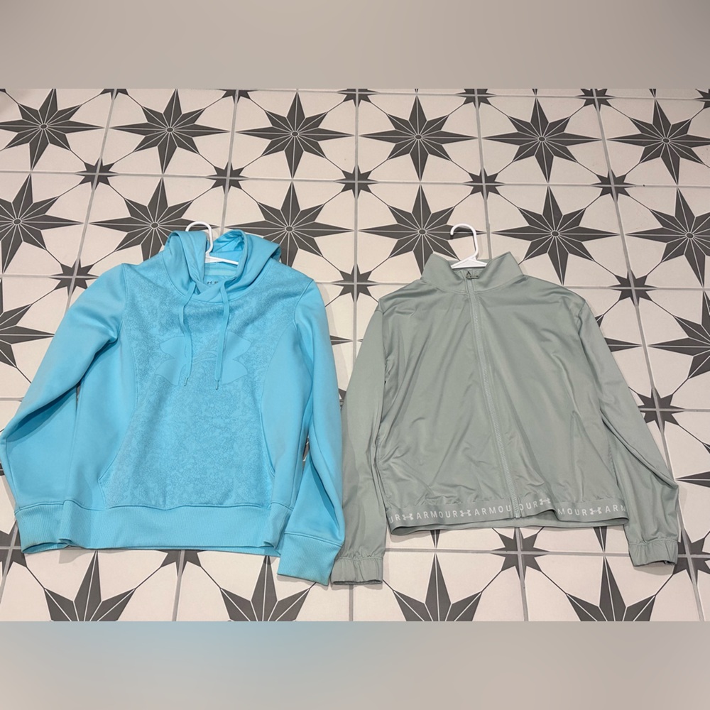 Under Armour women’s blue sweatshirt and green light jacket